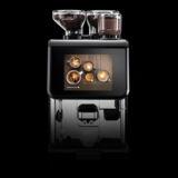 Coffee maker "Ultima Duo 2" by Kaffee Partner on black background