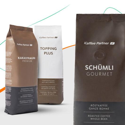 Drei verpackte Kaffeeprodukte: Kakaotraum Premium, Topping Plus und Schümli Gourmet Röstkaffee