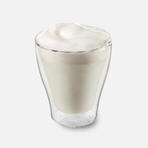 warm milk in a double-walled glass from Kaffee partner